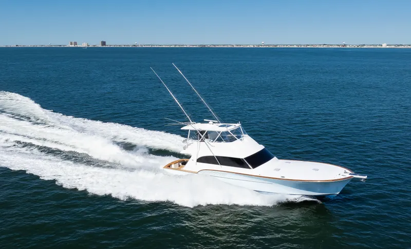  Yacht Photos Pics 2009 Buddy Davis Sportfish yacht cruising on open sea.