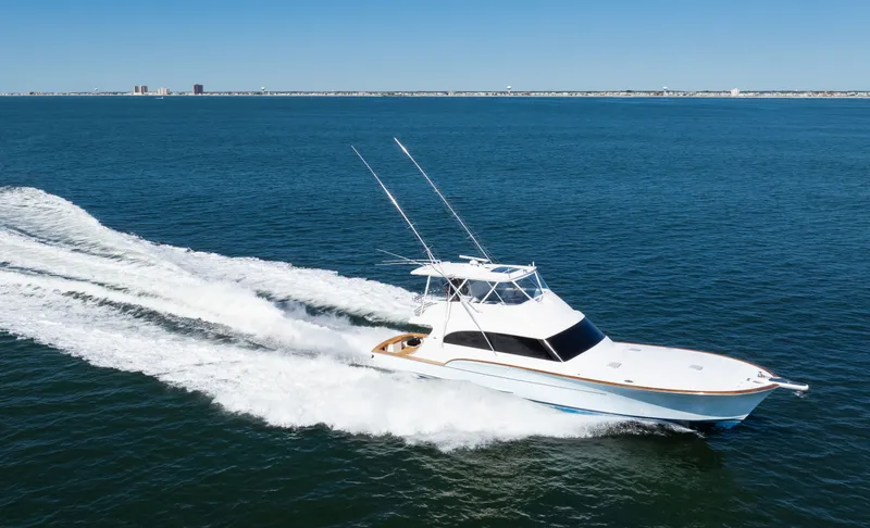  Yacht Photos Pics 2009 Buddy Davis Sportfish yacht cruising on open sea.