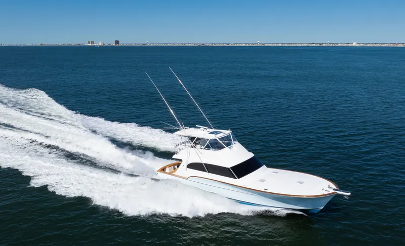  Yacht Photos Pics 2009 Buddy Davis Sportfish yacht cruising on open sea.