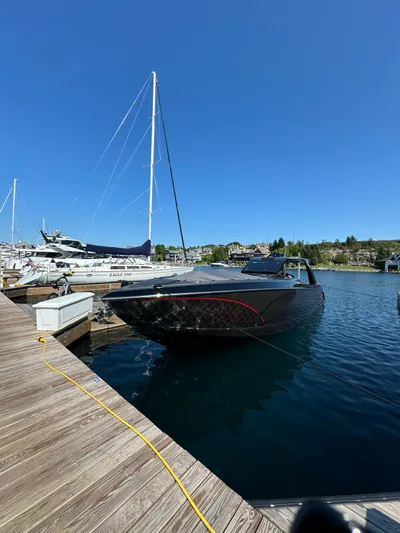 Incognito Yacht Photos Pics 2022 Cigarette 42 Nighteagle boat docked at marina under clear blue sky.