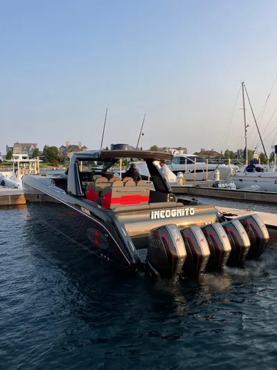 Incognito Yacht Photos Pics 2022 Cigarette 42 Nighteagle boat docked with powerful engines, calm water, and clear sky.