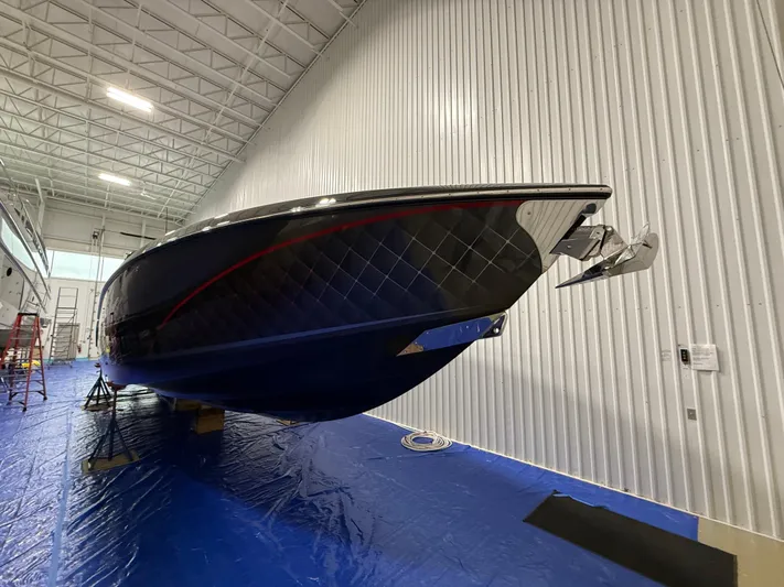 Incognito Yacht Photos Pics 2022 Cigarette 42 Nighteagle boat in a spacious indoor facility.