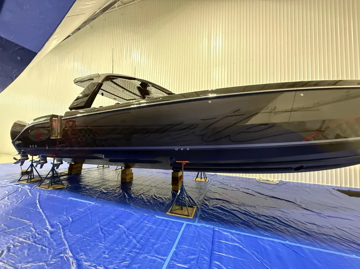 Incognito Yacht Photos Pics 2022 Cigarette 42 Nighteagle boat on stands in a storage facility.