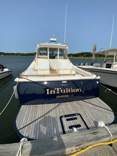 Intuition Yacht Photos Pics 2013 Tiara Yachts 36 docked, rear view with "InTuition" name visible.