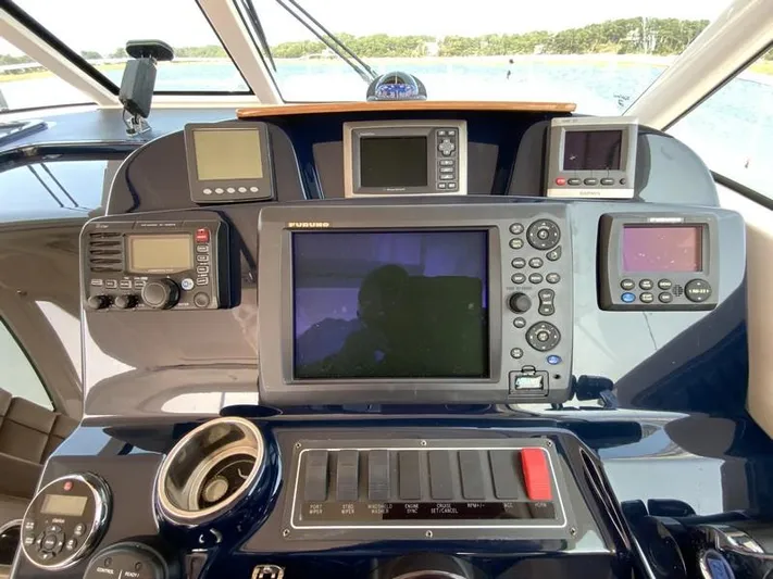 Intuition Yacht Photos Pics Control panel of a 2013 Tiara Yachts 36 with navigation and communication equipment.