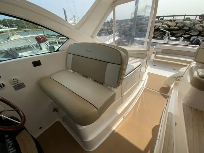Intuition Yacht Photos Pics Interior of 2013 Tiara Yachts 36, featuring beige seating and helm area.