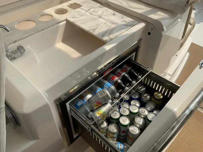 Intuition Yacht Photos Pics Tiara Yachts 36, 2013 model, featuring a built-in beverage cooler with assorted drinks.