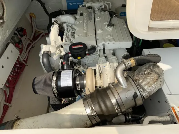 Intuition Yacht Photos Pics Engine compartment of a 2013 Tiara Yachts 36, showcasing detailed mechanical components.