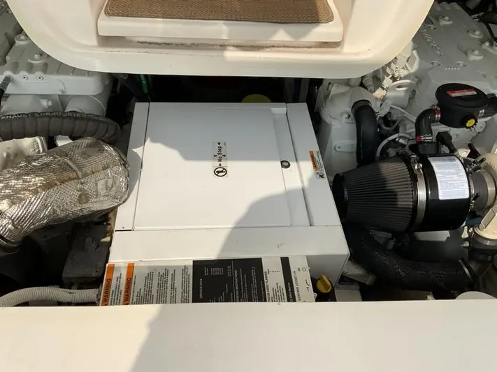 Intuition Yacht Photos Pics Engine compartment of a 2013 Tiara Yachts 36, showcasing mechanical components and systems.
