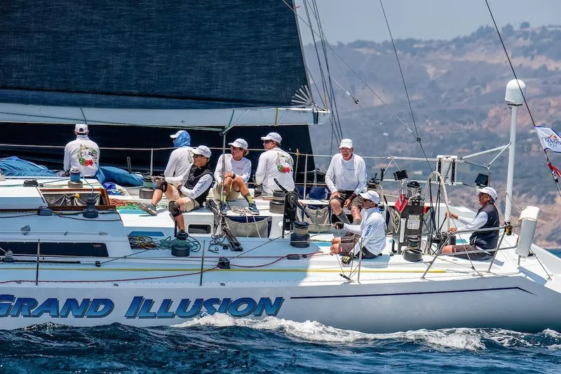 Grand Illusion Yacht Photos Pics Sailors aboard 1986 Santa Cruz 70 yacht "Grand Illusion" navigating coastal waters.