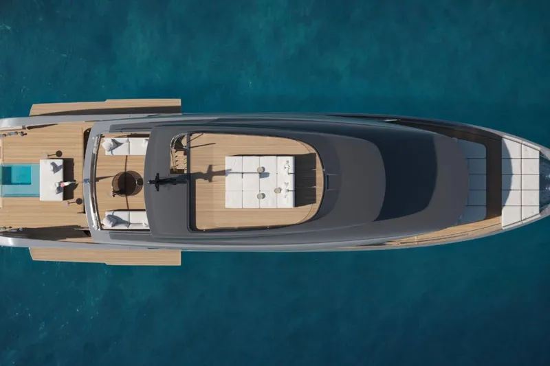  Yacht Photos Pics Top view of 2027 Sanlorenzo SX120 yacht on clear blue water.