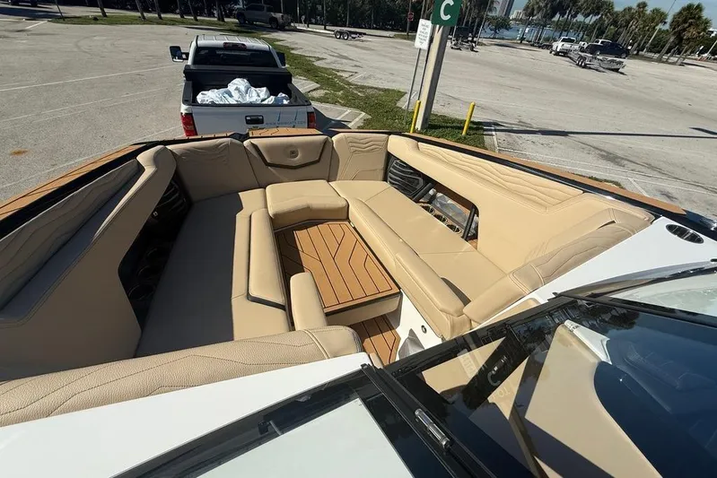  Yacht Photos Pics 2026 Nautique Super Air Nautique G25 Coastal Edition with luxurious seating and wooden accents.