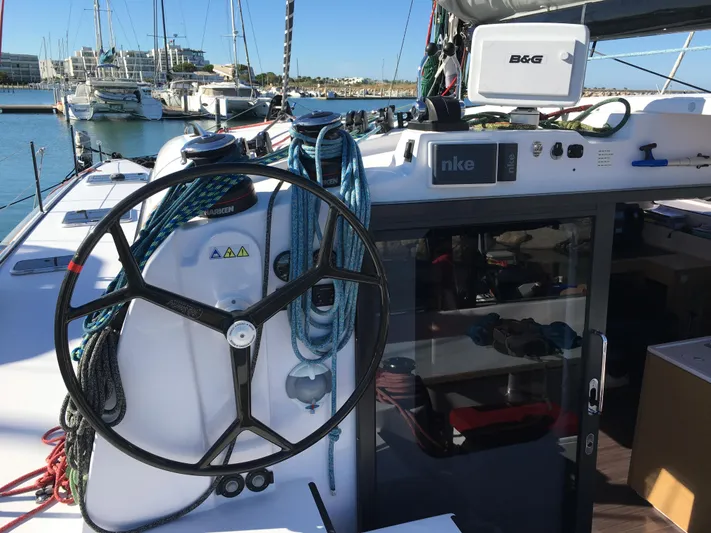 Inconceivable Yacht Photos Pics 2018 Outremer 4X sailboat cockpit with steering wheel and navigation equipment in marina.