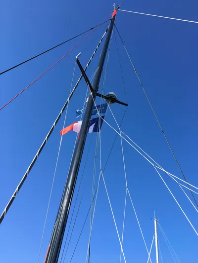 Inconceivable Yacht Photos Pics Mast of 2018 Outremer 4X sailboat against clear blue sky.