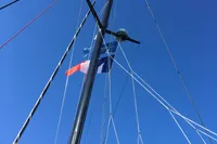 Mast of 2018 Outremer 4X sailboat against clear blue sky.