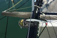 2018 Outremer 4X catamaran deck with rigging and netting over water.