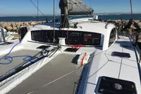2018 Outremer 4X catamaran on water, featuring sleek design and spacious deck.