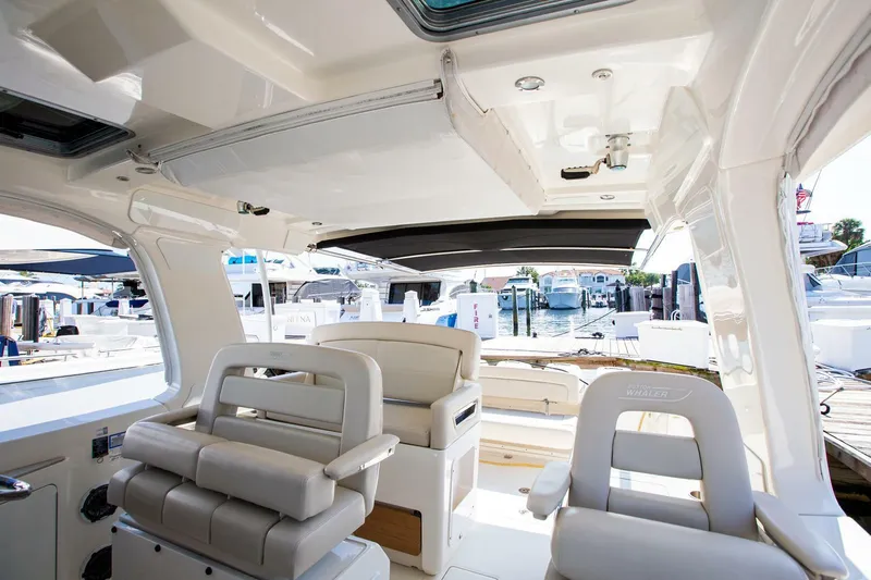  Yacht Photos Pics 2019 Boston Whaler 380 Realm interior with luxurious seating and modern design.