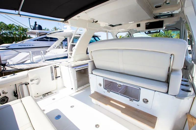  Yacht Photos Pics 2019 Boston Whaler 380 Realm interior with white seating and modern amenities.