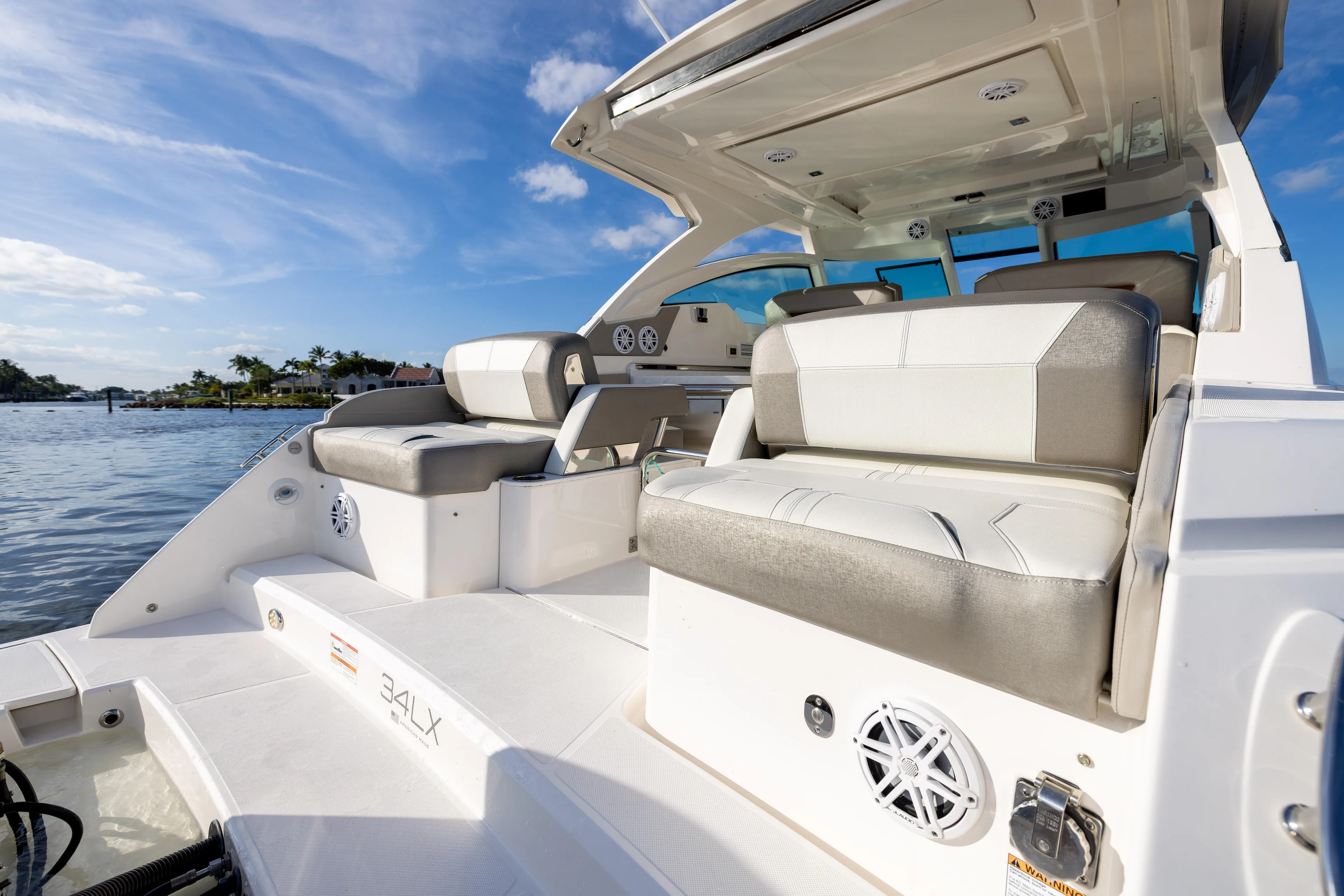 34 Tiara 2022 Yacht Photos Pics 2022 Tiara 34 LX boat interior with luxurious seating and scenic water view.