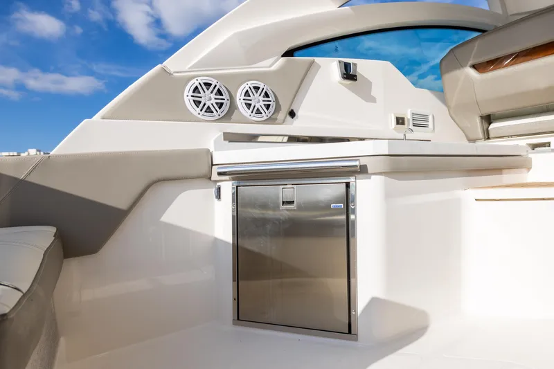 34 Tiara 2022 Yacht Photos Pics 2022 Tiara 34 LX boat interior with stainless steel fridge and modern design.