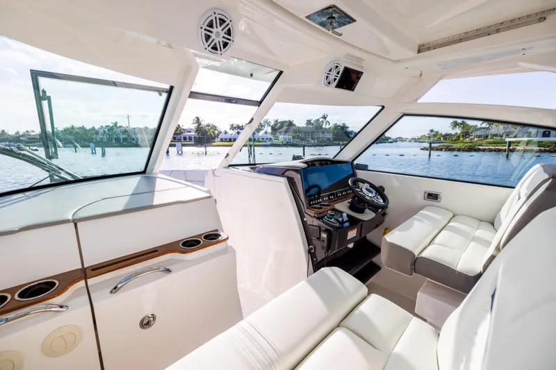 34 Tiara 2022 Yacht Photos Pics Interior of 2022 Tiara 34 LX boat with luxurious seating and modern dashboard.
