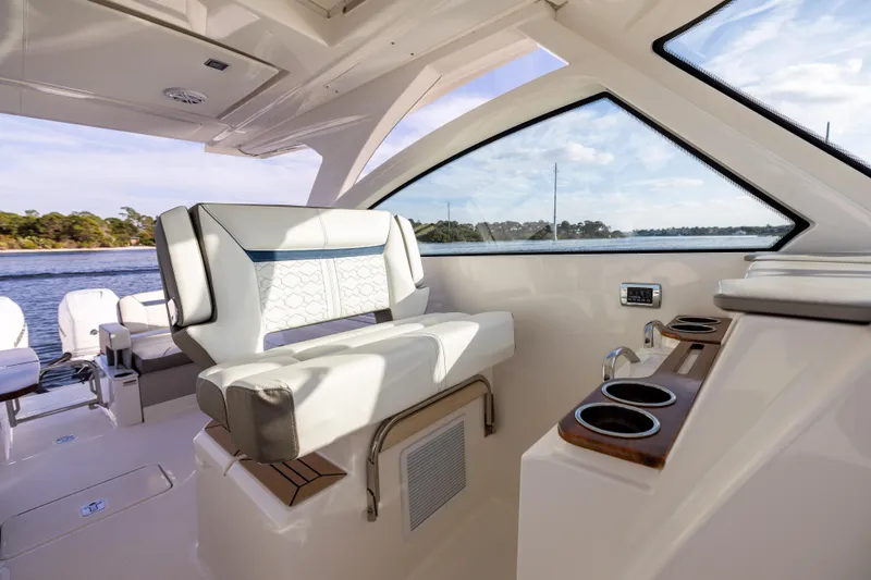 34 Tiara 2022 Yacht Photos Pics Luxurious interior of 2022 Tiara 34 LX boat with comfortable seating and cup holders.