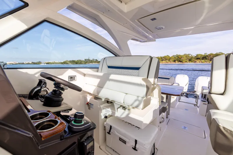 34 Tiara 2022 Yacht Photos Pics Interior of 2022 Tiara 34 LX yacht with modern helm and seating.