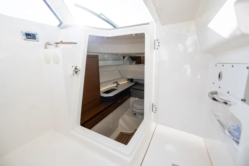 34 Tiara 2022 Yacht Photos Pics Interior view of 2022 Tiara 34 LX yacht bathroom with modern fixtures.
