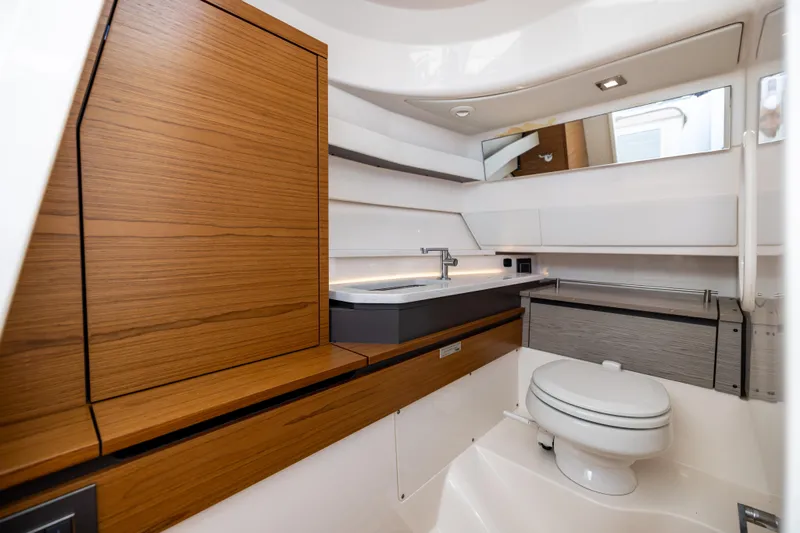 34 Tiara 2022 Yacht Photos Pics Luxurious 2022 Tiara 34 LX yacht bathroom with modern wood and white design.