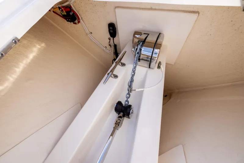 34 Tiara 2022 Yacht Photos Pics Anchor chain compartment of 2022 Tiara 34 LX boat, featuring modern equipment.