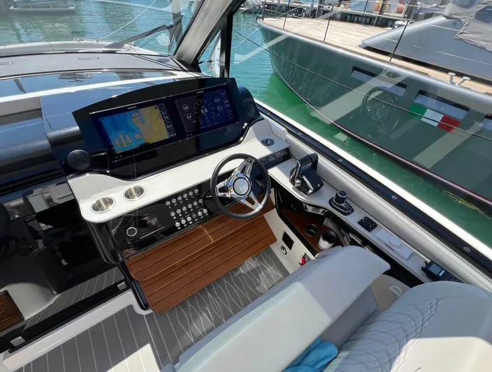 Donna Jane Yacht Photos Pics 2023 Sea Ray Sundancer 370 OB helm station with advanced navigation system.