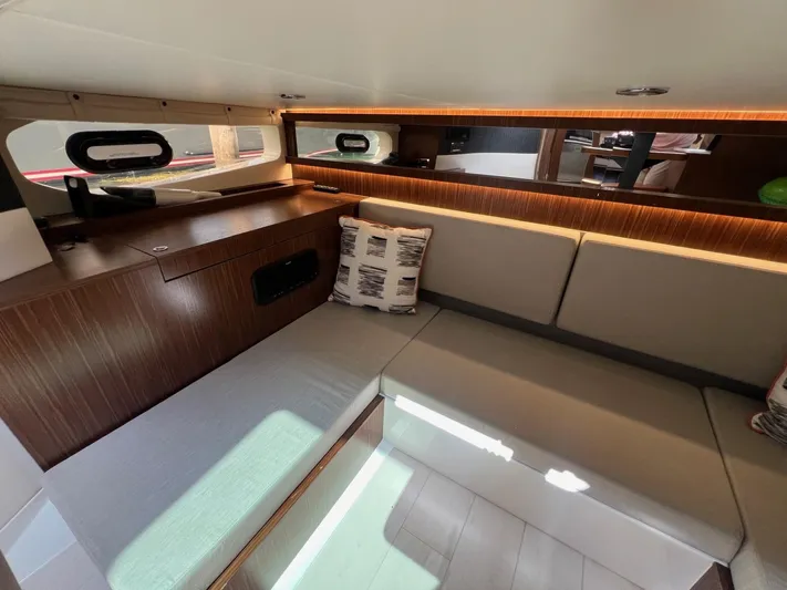 Donna Jane Yacht Photos Pics Interior of 2023 Sea Ray Sundancer 370 OB with modern seating and wooden accents.