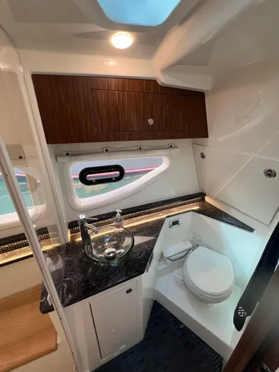 Donna Jane Yacht Photos Pics 2023 Sea Ray Sundancer 370 OB bathroom with modern fixtures and sleek design.