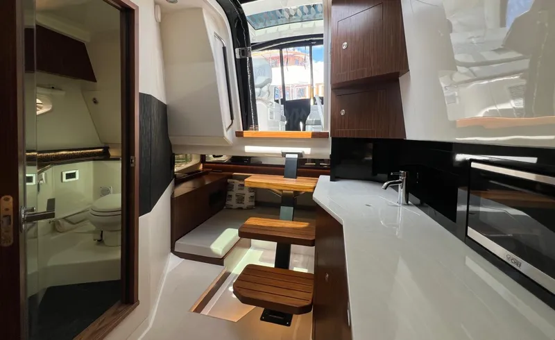 Donna Jane Yacht Photos Pics Interior of 2023 Sea Ray Sundancer 370 OB yacht with modern kitchen and bathroom.