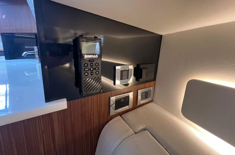 Donna Jane Yacht Photos Pics Control panel and electronics in 2023 Sea Ray Sundancer 370 OB cabin.