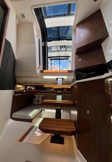 Donna Jane Yacht Photos Pics Interior of 2023 Sea Ray Sundancer 370 OB yacht with modern wood finishes.
