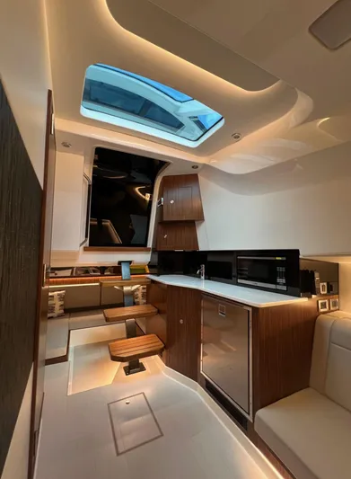 Donna Jane Yacht Photos Pics 2023 Sea Ray Sundancer 370 OB interior with modern kitchen and skylight.