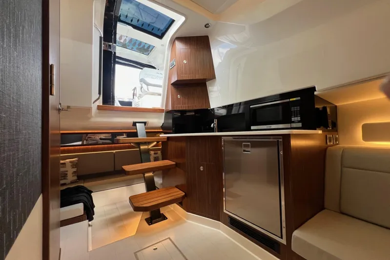 Donna Jane Yacht Photos Pics Interior of 2023 Sea Ray Sundancer 370 OB with modern kitchen and seating area.