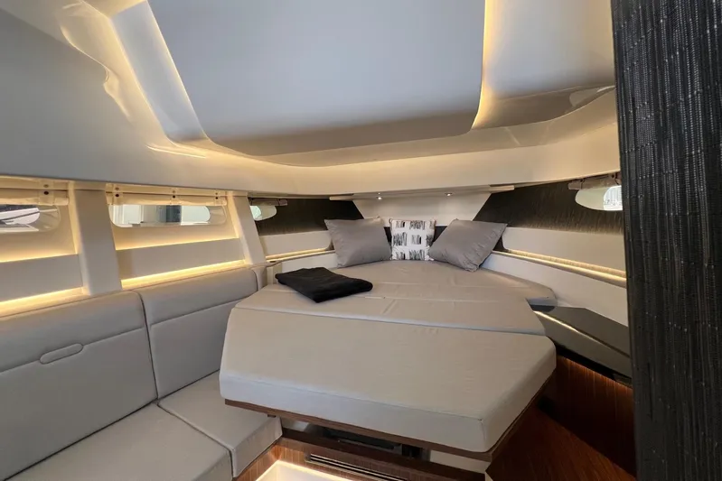 Donna Jane Yacht Photos Pics Luxurious interior of 2023 Sea Ray Sundancer 370 OB with modern bedding and ambient lighting.