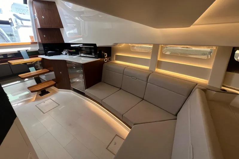 Donna Jane Yacht Photos Pics Interior of 2023 Sea Ray Sundancer 370 OB yacht with modern kitchen and cozy seating area.
