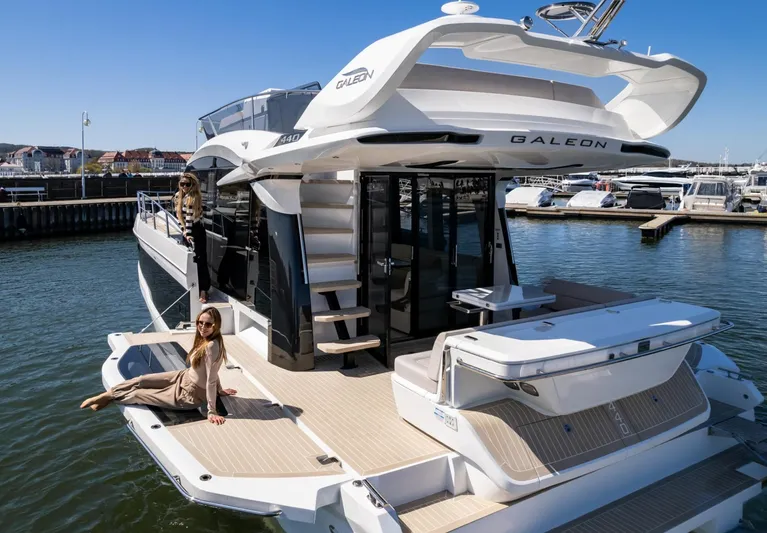  Yacht Photos Pics 2026 Galeon 440 Fly yacht docked, featuring spacious deck and modern design.