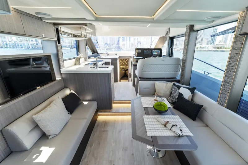  Yacht Photos Pics Luxurious interior of 2026 Galeon 440 Fly yacht with modern seating and dining area.