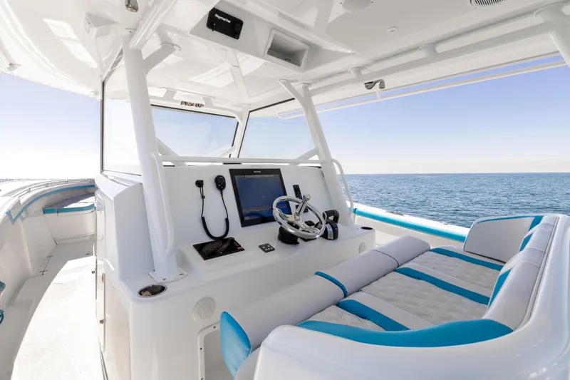 Fins Up Yacht Photos Pics 2017 Yellowfin 42 Offshore boat interior with modern helm and ocean view.