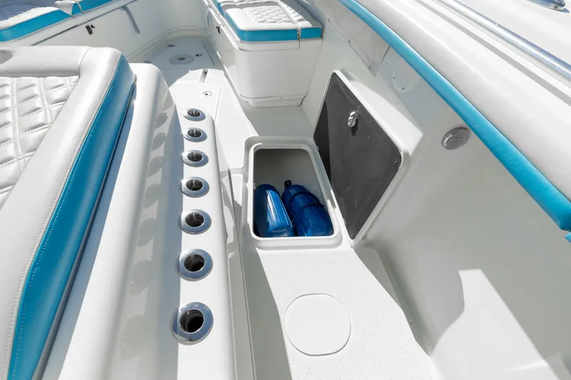 Fins Up Yacht Photos Pics 2017 Yellowfin 42 Offshore boat interior with storage compartment and rod holders.