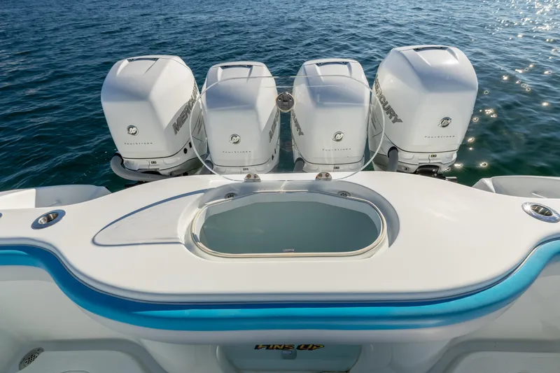 Fins Up Yacht Photos Pics 2017 Yellowfin 42 Offshore boat with four Mercury outboard engines on the water.