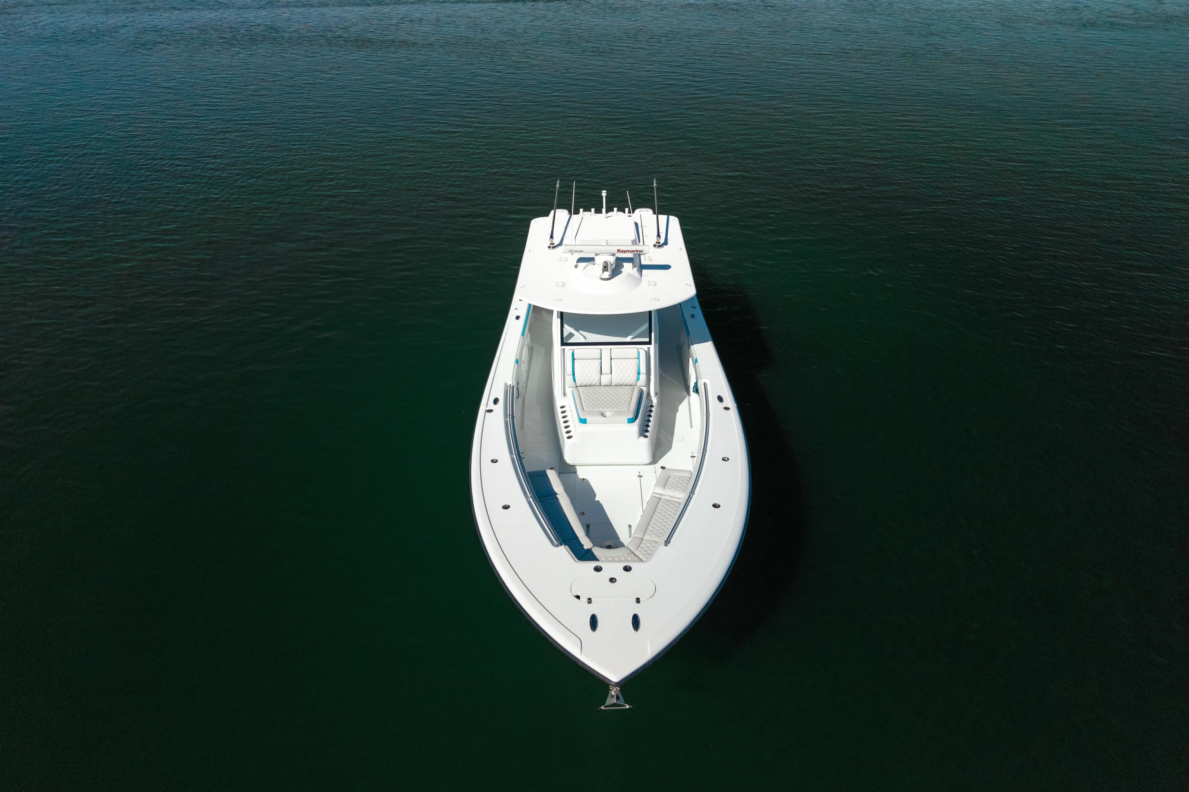 Fins Up Yacht Photos Pics 2017 Yellowfin 42 Offshore boat on calm water, aerial view.