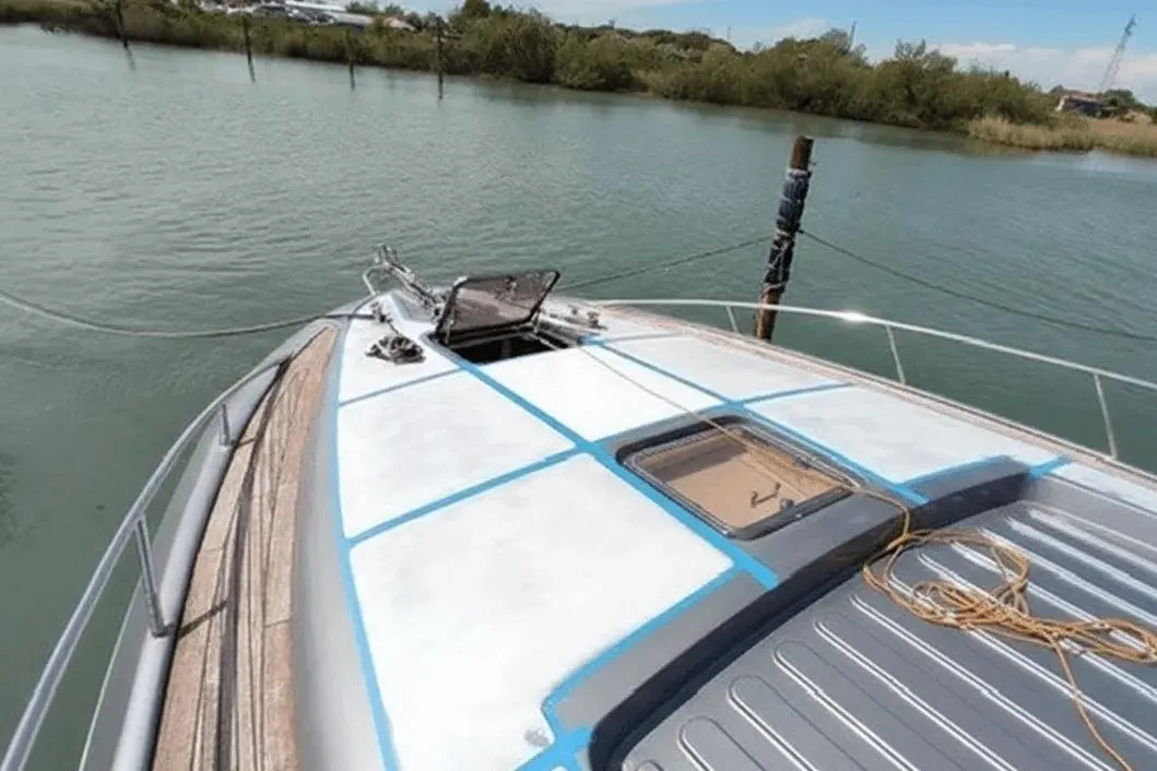 2004 AB Yacts 68 yacht docked on calm water, featuring a sleek deck design.