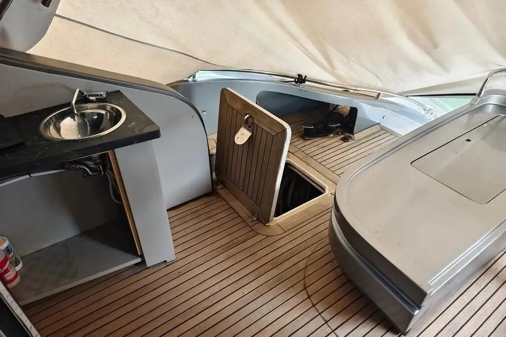 Interior of 2004 AB Yachts 68, featuring a sink and wooden flooring.
