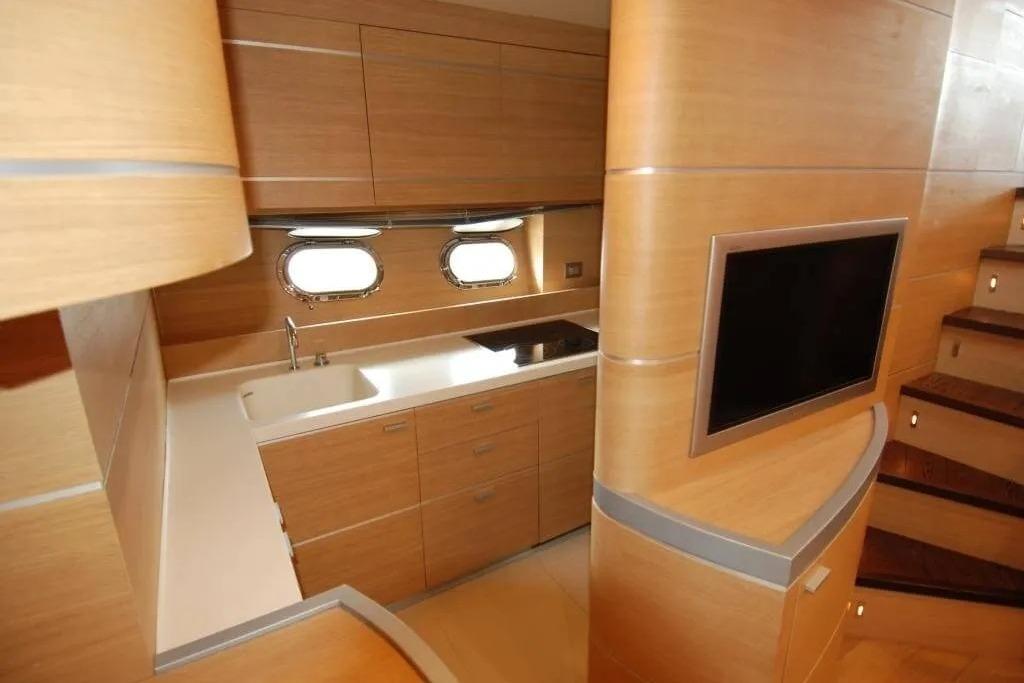 Luxurious interior of 2004 AB Yachts 68, featuring modern kitchen and sleek design.